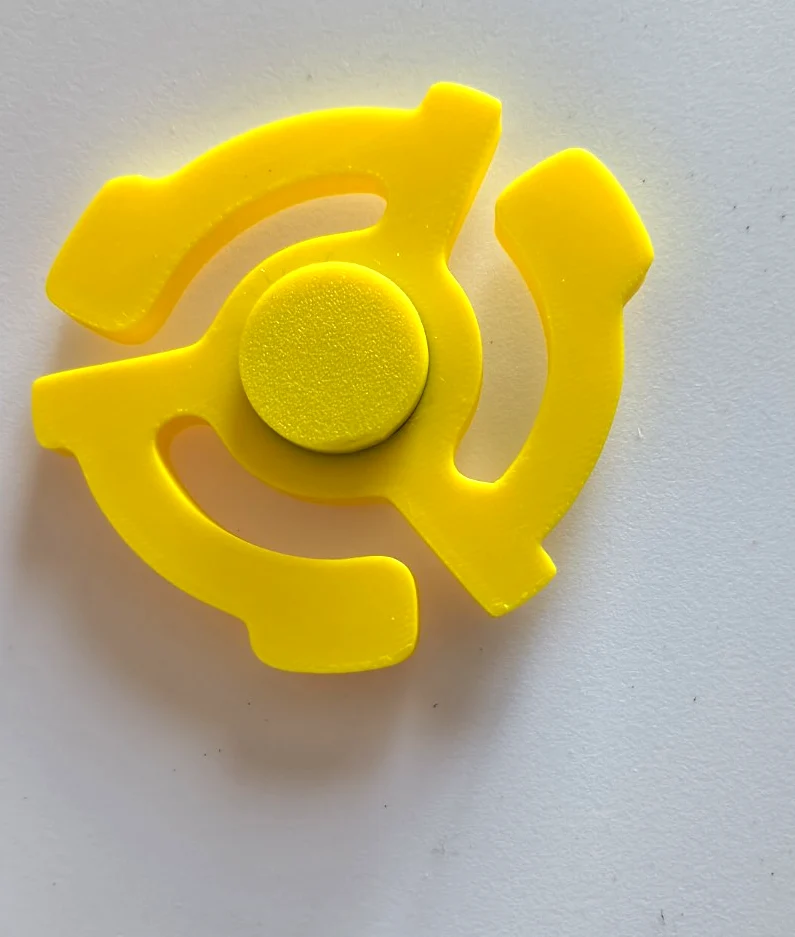 Yellow record-inspired fidget spinner, actual product photo